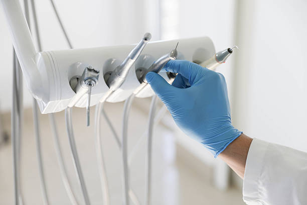 Professional Tooth Extraction technician working in Calera, AL